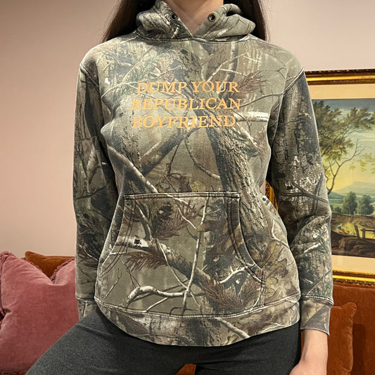 DUMP YOUR REPUBLICAN BOYFRIEND camo hoodie with orange text (S)