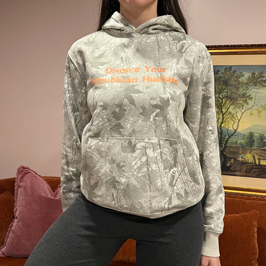 DIVORCE YOUR REPUBLICAN HUSBAND white camo hoodie with orange text (S)