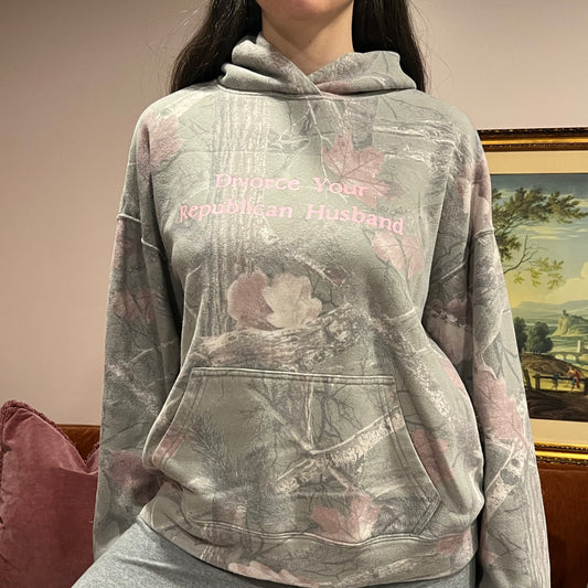 DIVORCE YOUR REPUBLICAN HUSBAND camo hoodie with pink text (S)